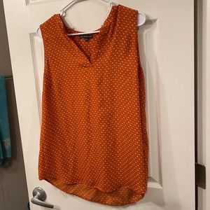 Women’s orange and white polka dot shirt